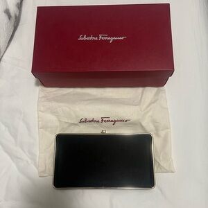 Black velvet and gold detail Ferragamo clutch with detachable gold chain.
